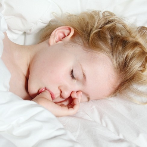 Child resting after sedation dentistry visit