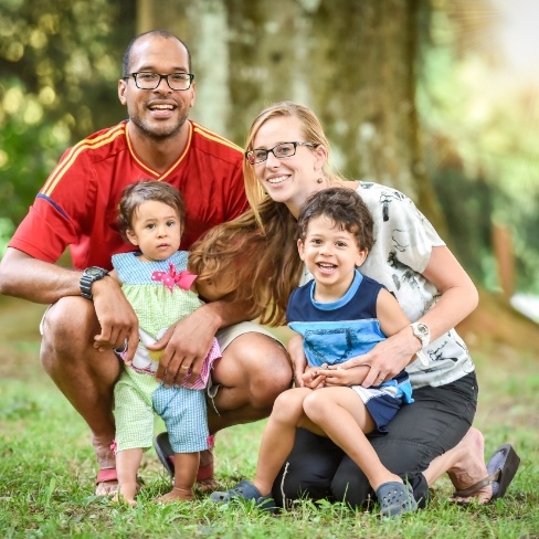 Smiling parents and children after dentistry for toddlers