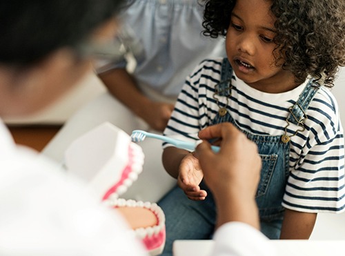 child opening their mouth for a dental checkup