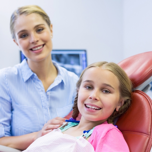 Child smiling after silver diamine fluoride treatment