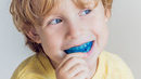 child wearing a dental mouthguard