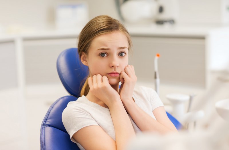 A girl with dental anxiety